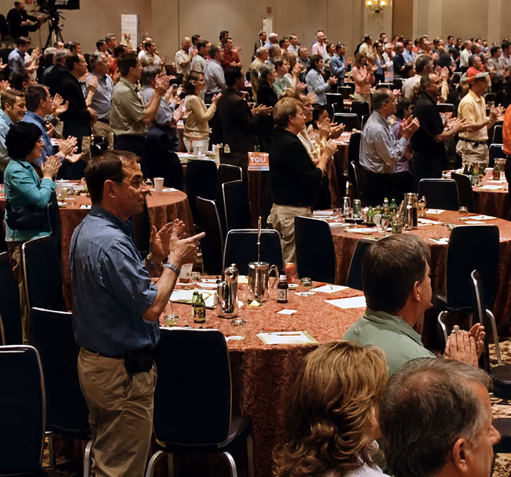 The audience at a 2006 leadership conference demonstrates the firm’s added scale after the American Express TBS acquisition.
