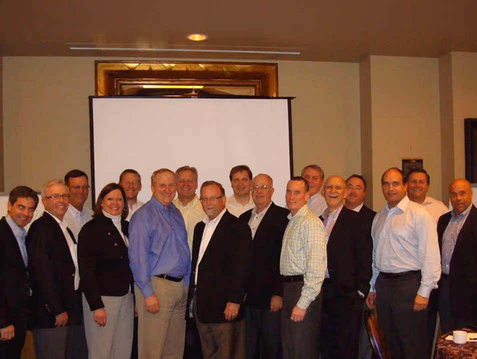 The leadership team for the newly reunited firm in December 2011.